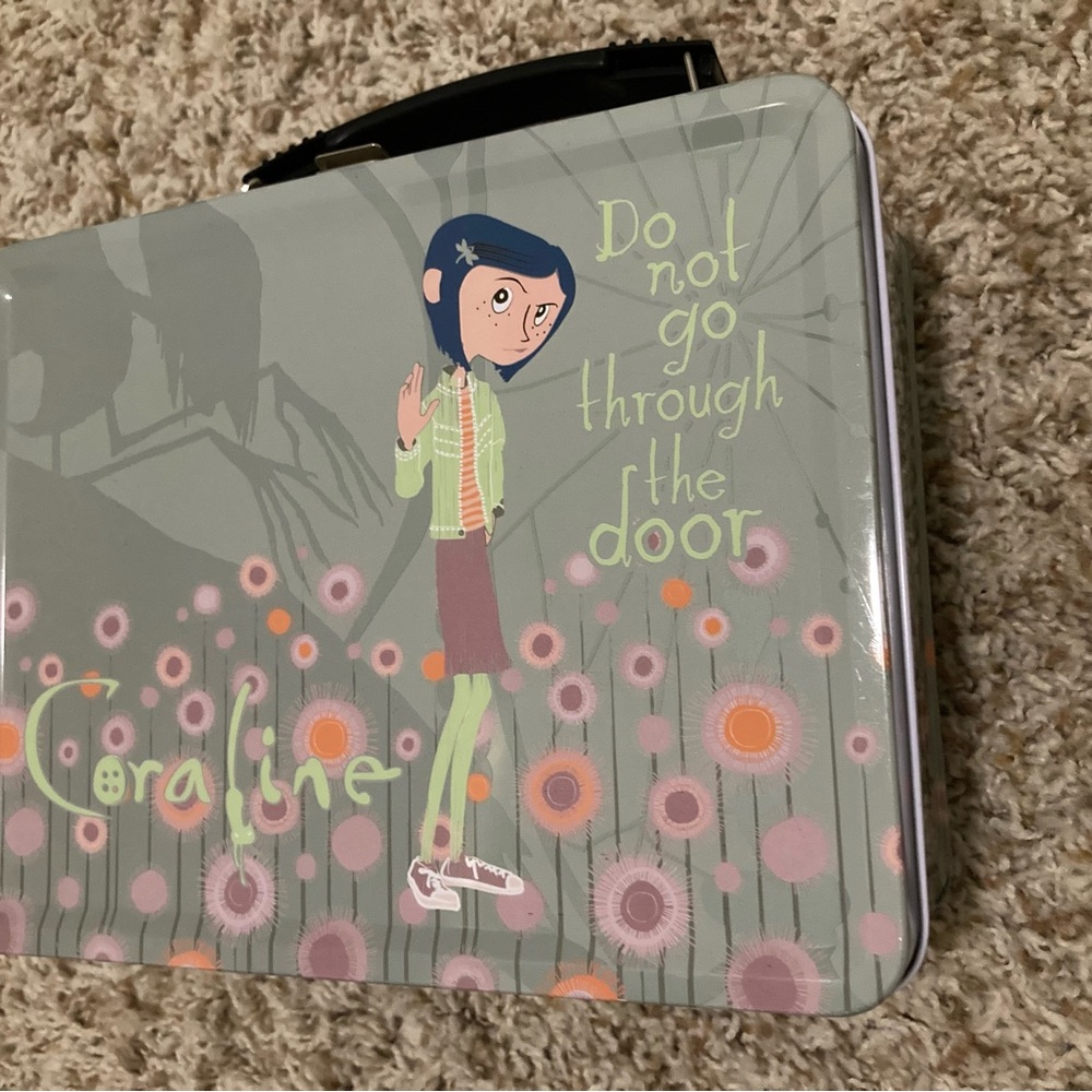 SOLD - NECA - Coraline "Do not go through the door" Metal Lunchbox DAMAGED